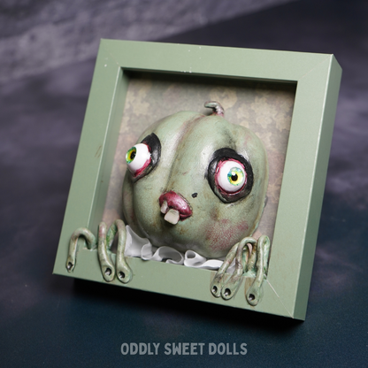 FRAMED PUMPKIN with big eyes and teeth