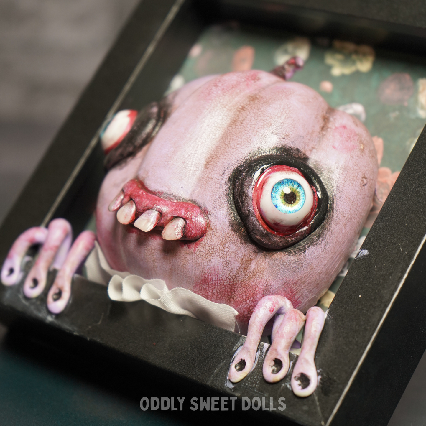 framed pumpkin with big eyes and teeth