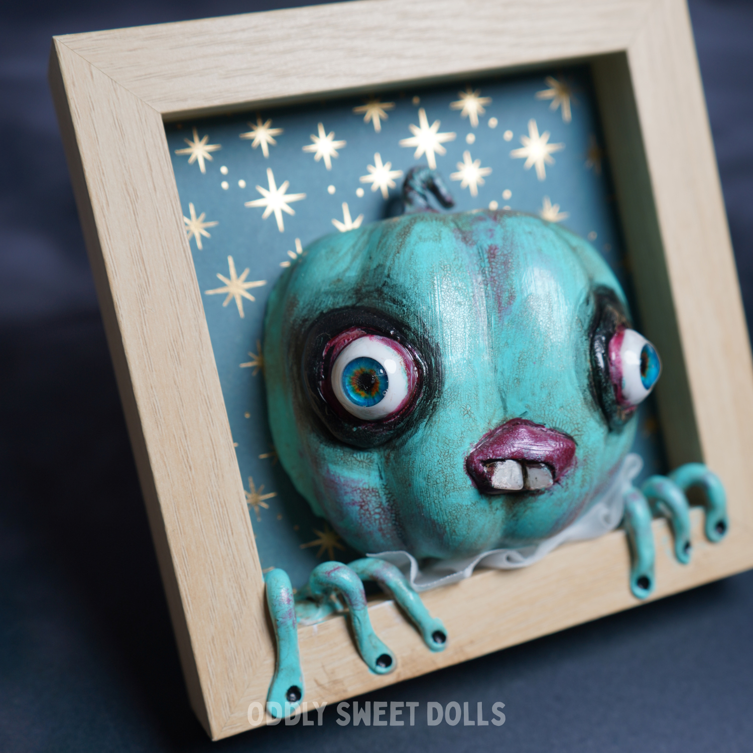 framed pumpkin with big eyes and teeth