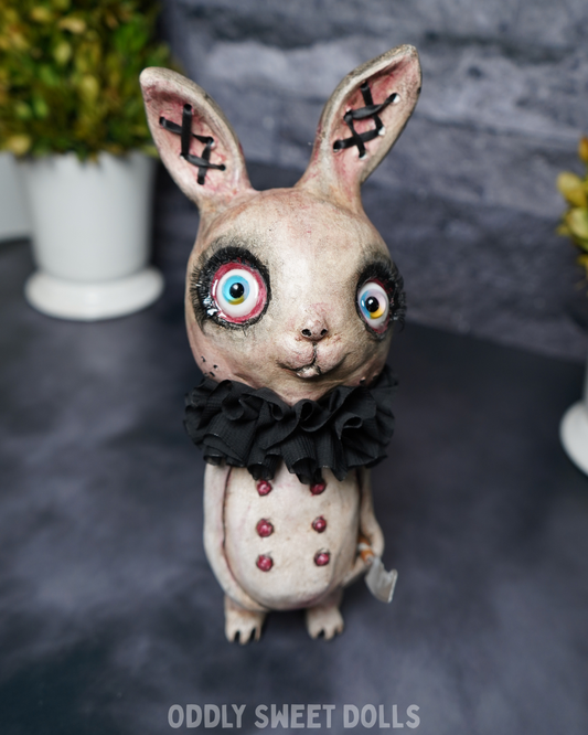 big eyed bunny with black collar