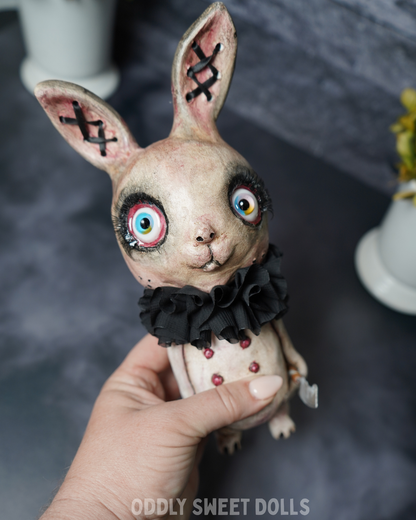 big eyed bunny with black collar