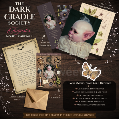 A flat lay of 'The Dark Cradle Society' August art mail contents on a dark wood background, featuring vintage-style cards, a letter, an envelope, stickers, and a list of included items.
