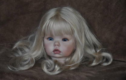 A realistic blonde doll head with long wavy hair, blue eyes, and a pale pink face, photographed against a dark brown textured background.