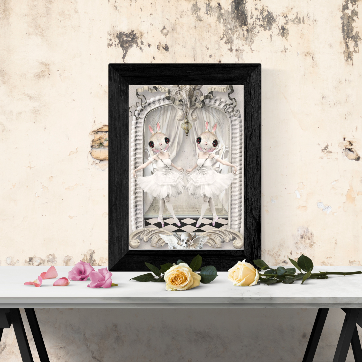 framed bunny ballerina art piece sitting on table with yellow and pink roses